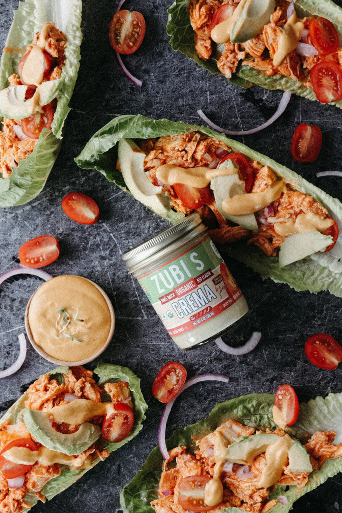 Buffalo Chicken Lettuce wrap topped with ZUBI’S Queso